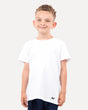 A child wearing a white regular t-shirt, standing against a white background.