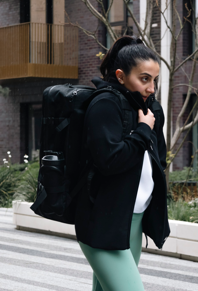 Close-up of a female athlete wearing a black Northern Spirit winter jacket, technical outerwear designed for training and everyday use.