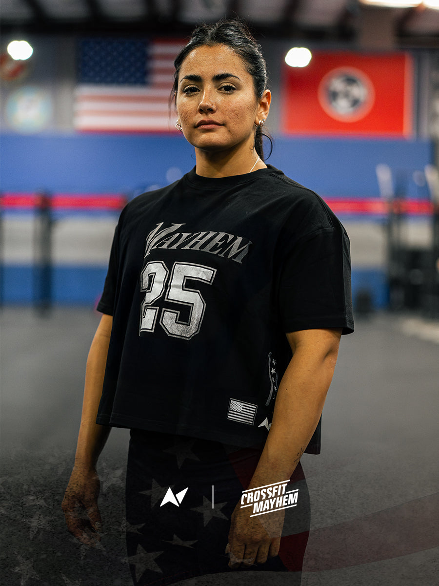 Crossfit women wearing Mayhem x Northern Spirit t-shirt in a gym