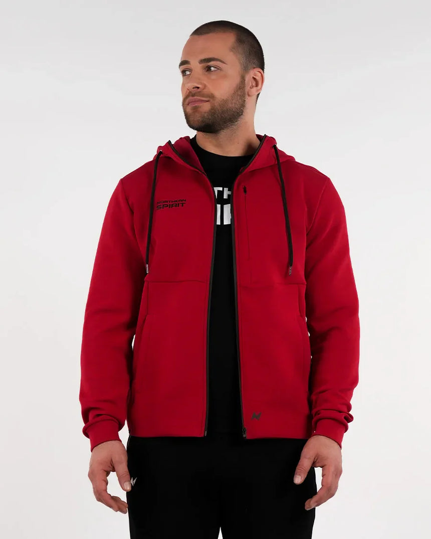 Unisex red Northern Spirit jacket with tone-on-tone logo, water-repellent zip-up style perfect for warm-up or travel.