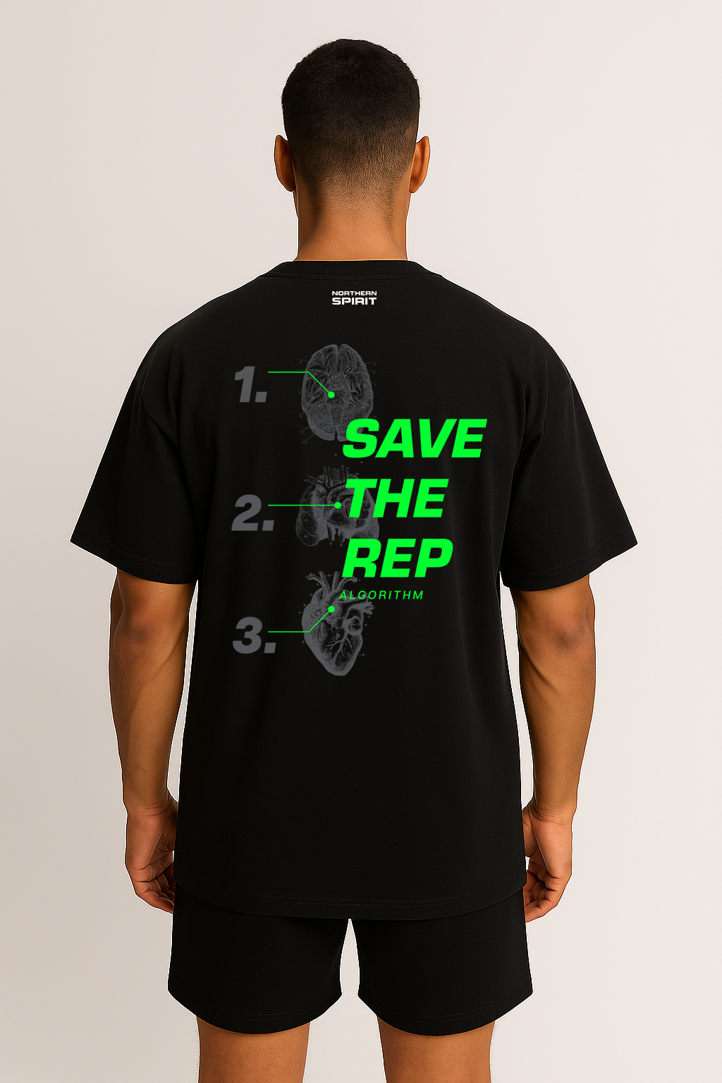 Male model wearing black oversized Save The Rep Algorithm T-shirt, back print showing brain, heart, and lungs design with SAVE THE REP in green.