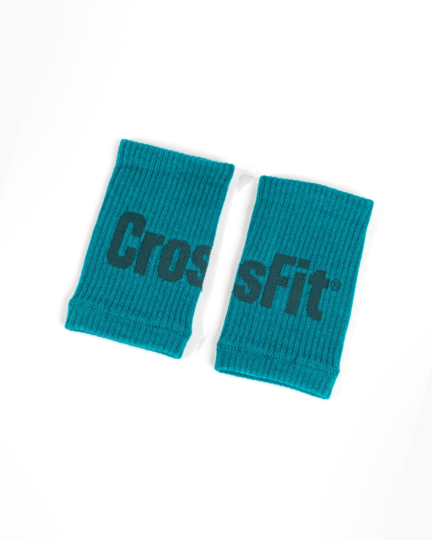 CrossFit wristbands in emerald green – soft elastic sweatbands designed for training comfort and moisture absorption.