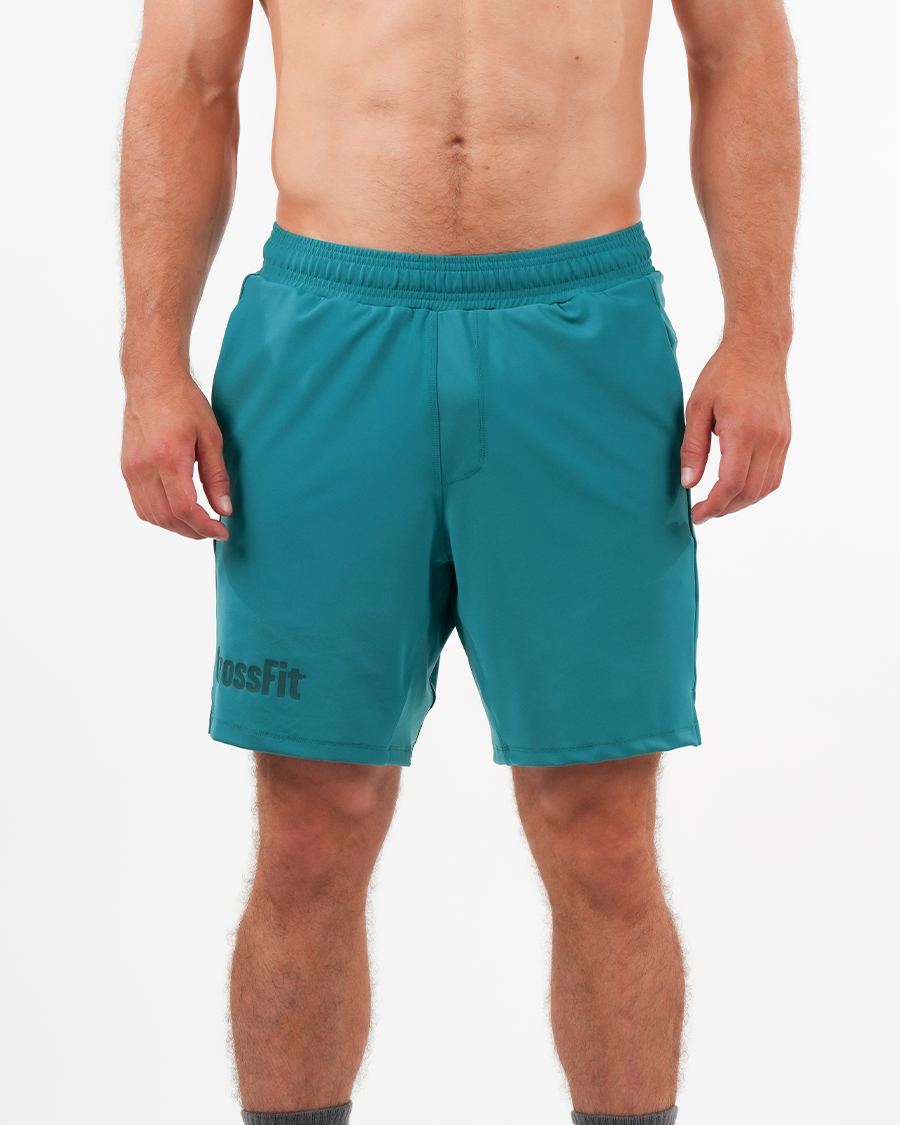 Men’s emerald green CrossFit® 8-inch shorts with tone-on-tone logo, high-performance flexible fabric for workouts.
