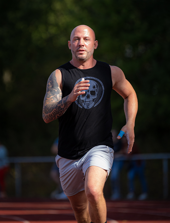 Man running outdoors with a blurred background