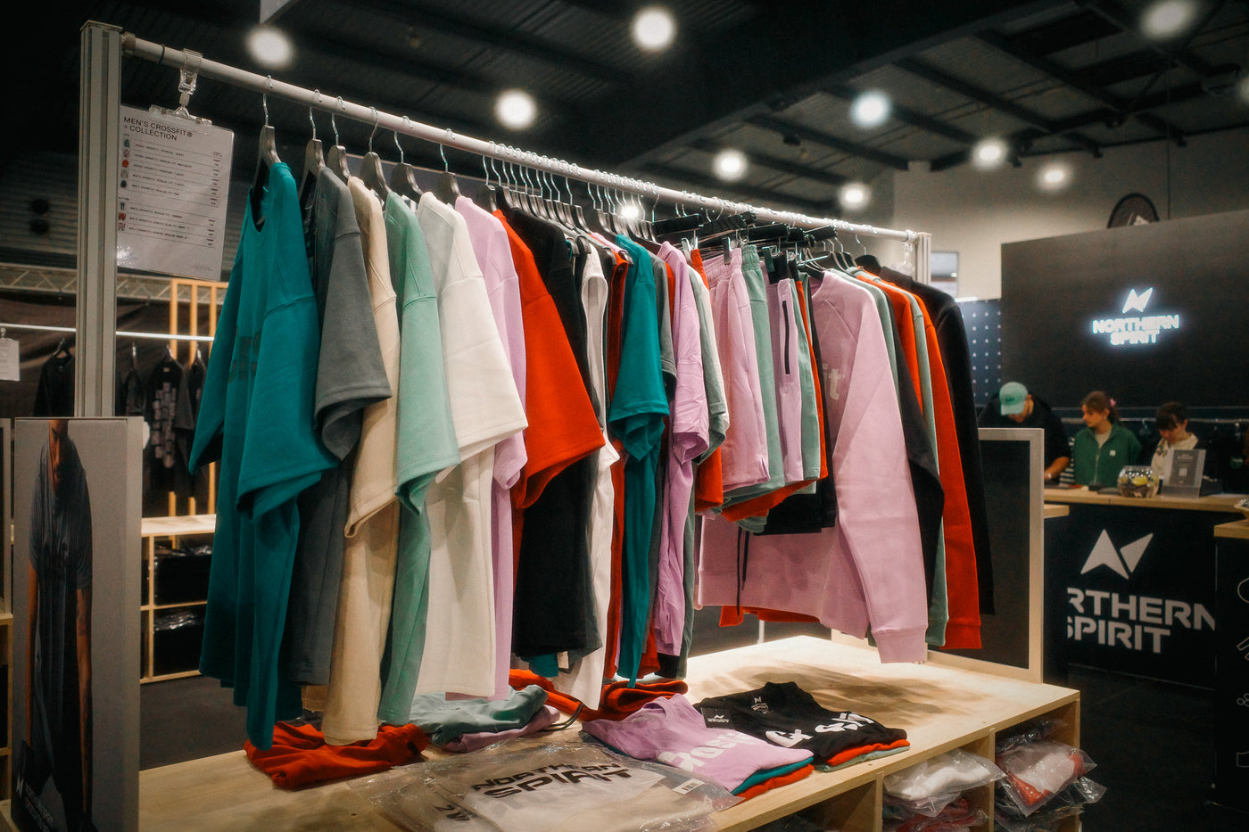 Northern Spirit CrossFit sportswear on display, promoting the Recycle Program where customers return clean, wearable items for responsible recycling and reuse.