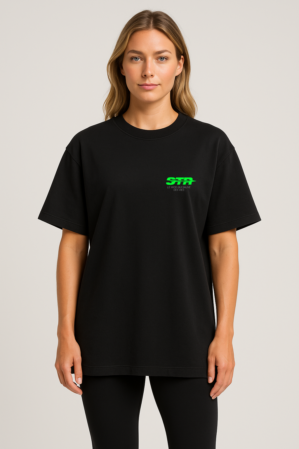 Female model wearing black oversized Save The Rep Algorithm T-shirt, STR neon green logo on chest, minimalist streetwear style.