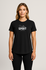 Woman wearing a fitted black Northern Spirit script logo T-shirt standing facing forward in a neutral studio setting